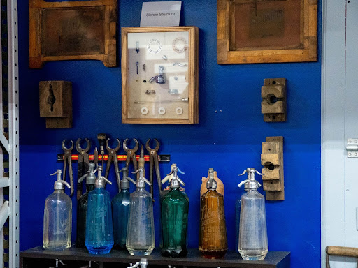 Several old siphon bottles displayed at the Brooklyn Seltzer Museum