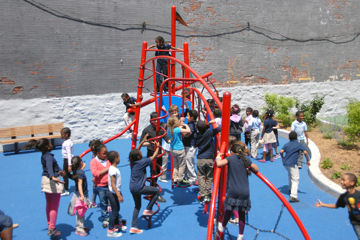 Students play on the playground at Teachers College Community School